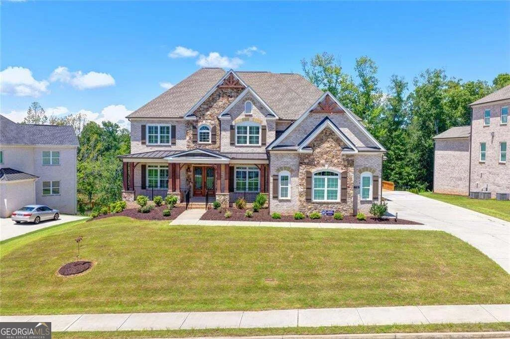 Brick front exterior and landscaped lawn at 7720 Wild Violet Drive