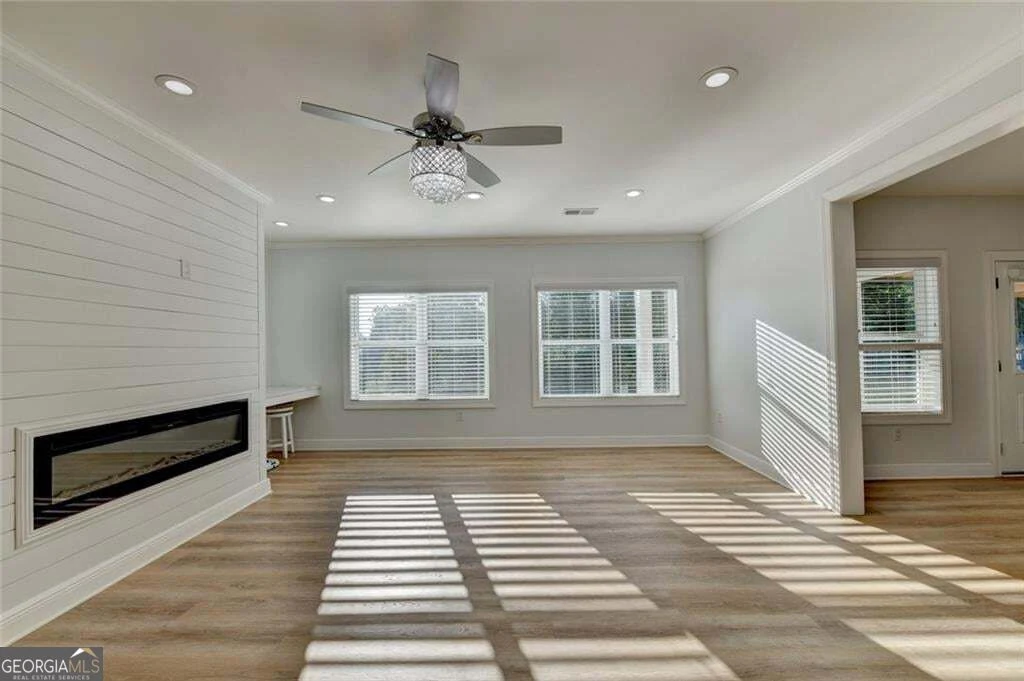 Finished terrace living area with fireplace and backyard-facing windows